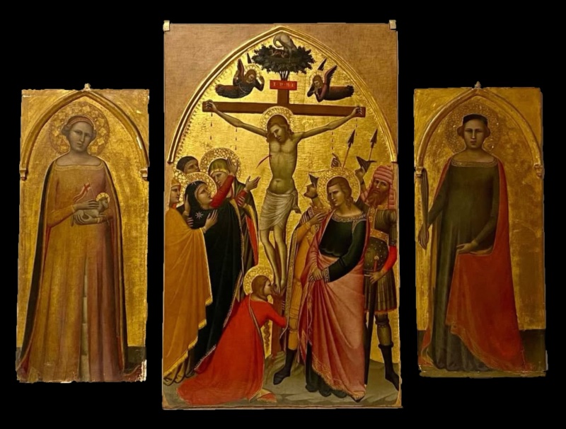 Three Gothic panels by Allegretto Nuzi on gold ground: in the centre the Crucifixion, with Christ on the Cross, two lamenting angels and a pelican in a nest on a tree at the top, the fainting Virgin in a dark mantle supported by holy women, Mary Magdalene in red kneeling at the foot of the Cross, Saint John in a pink mantle and soldiers with spears and a man in a turban on the right; on the left panel Saint Agnes in a pink-orange gown holding a lamb; on the right panel a female saint in a dark green gown and red mantle