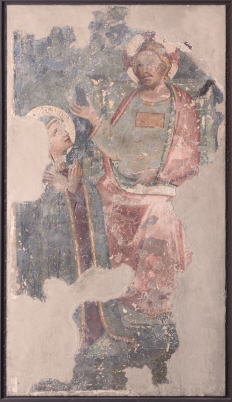 Detached fresco, heavily damaged, mounted on canvas within a dark frame; large areas of loss are filled with neutral grey plaster. On the right, Christ sits on a green architectural throne, bearded, with long reddish-blond hair and a halo. He wears a pale greenish-blue tunic with a small rectangular gold ornament on the breast and a rose-red mantle draped over his shoulders and knees. His right hand is raised, open, towards the Virgin, and his left rests on his lap. On the left, the Virgin kneels in profile, haloed, wearing a dark mantle edged with gold over a red dress, her hands crossed on her breast and her face lifted towards Christ. Fragments of a painted frame survive along the left and lower edges