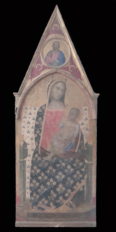 Gothic cusped panel painting, much abraded. The crowned Virgin sits frontally on a green stone throne with scrolled armrests, set on a low dais. She wears a red dress and a dark blue-black mantle patterned with gold vine leaves and bunches of grapes, edged with a gold border, and a dark veil over her head. On her left knee she holds the Christ Child, who turns and reaches up towards her; his pale garment is touched with blue. Behind her hangs a white cloth of honour decorated with blue trefoils and small red crosses. In the gable above, a roundel contains the half-length blessing Christ holding a book, surrounded by three red seraphim