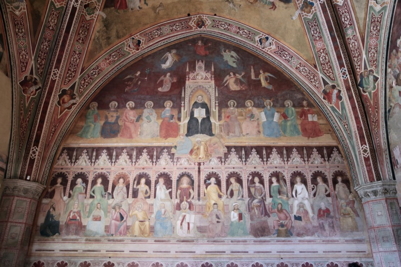 Santa Maria Novella, Spanish Chapel: the west wall, with St Thomas Aquinas enthroned among the authors of Scripture, the vanquished heretics crouching beneath his throne, and the fourteen personified sacred sciences and liberal arts ranged in a canopied arcade below, each with her historical exemplar seated at her feet