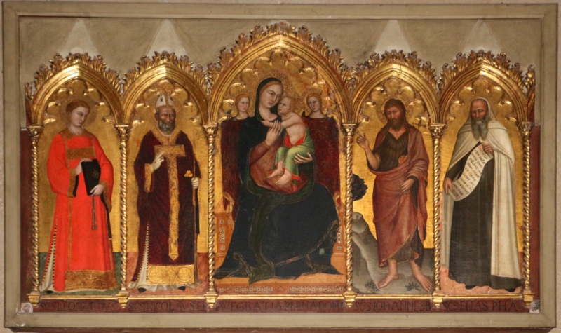 Five-part polyptych by Andrea di Bonaiuto in the sacristy of Santa Maria del Carmine, Florence, showing the Virgin and Child embracing on a throne with two angels, flanked by St Leonard with fetters, St Nicholas of Bari with crozier and golden balls, John the Baptist pointing, and the prophet Elijah in the white Carmelite mantle holding a scroll, tempera and gold on panel, c. 1360-62
