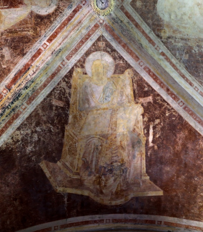 Triangular web of a Gothic vault in deep red-brown, bordered by white ribs with red star-and-chequer ornament meeting at a painted boss. A haloed figure in pale yellow-white robes sits frontally on a large architectural marble throne with a high back and projecting stepped footrest; the surface is heavily abraded, the face nearly effaced, the throne drawn in confident perspective lines.
