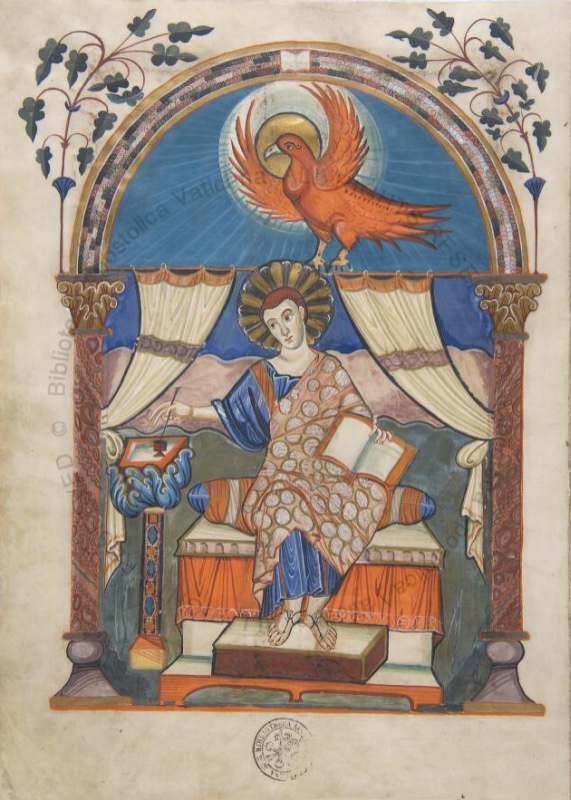 Full-page miniature from the Codex Aureus of Lorsch: Saint John seated frontally on a cushioned throne in a gold patterned mantle, dipping his pen into an inkstand beside an open book, while his symbol, a red eagle with a gold halo, descends with spread wings against a blue sky streaming with white rays, framed by an ornamented arch with drawn curtains