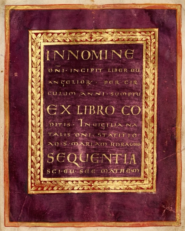 Medieval manuscript page stained deep purple, with an outer edge of gold and red: at its centre a rectangular panel framed by a gold garland of leaves between thin red and gold lines carries nine lines of gold capital letters of varying sizes on purple, beginning IN NOMINE and including the larger lines EX LIBRO CO and SEQUENTIA.