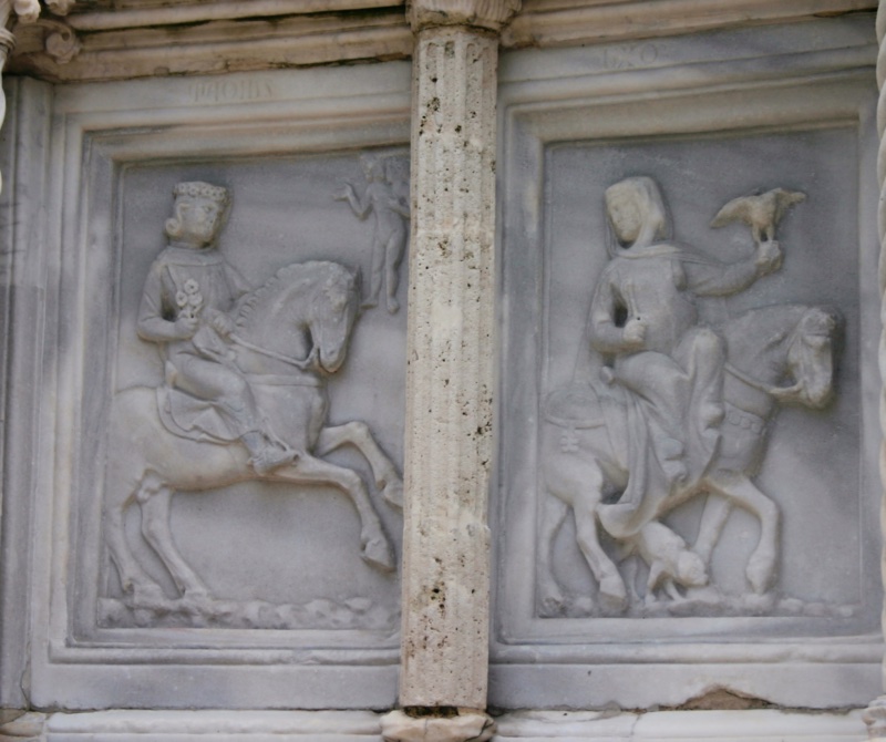 Fontana Maggiore, Perugia: May relief, a young nobleman on horseback offering flowers and a lady riding with a falcon on her fist