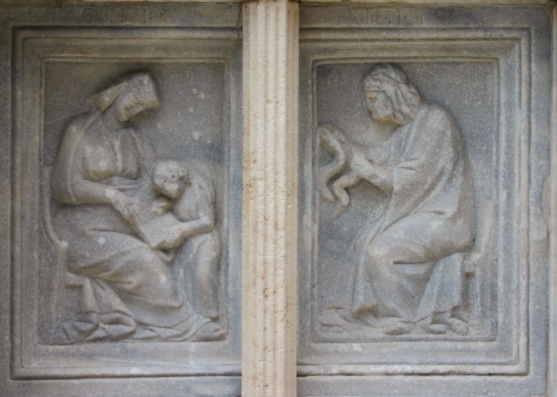 Fontana Maggiore, Perugia: Grammar teaching a child bent over a book, and Dialectic examining the serpent in her hands, 1278