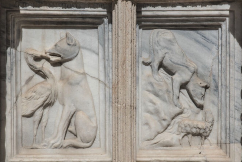 Fontana Maggiore, Perugia: Aesopic fable panels of the crane drawing the bone from the wolf's throat, and the wolf accusing the lamb downstream