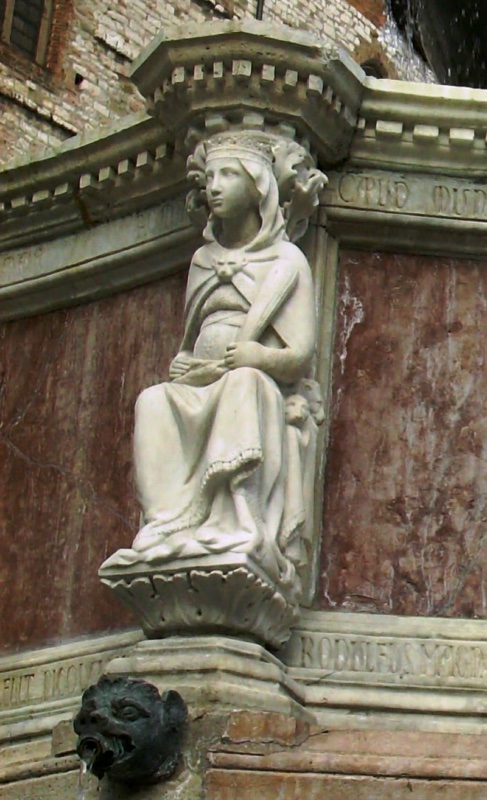 Fontana Maggiore, Perugia: enthroned statue of Roma with mural crown and lion-head clasp, legend CAPUD MUNDI, above the dating verses of pope and emperor; the figure in situ is a copy, the 1278 original damaged in 1859 is in the Galleria Nazionale dell'Umbria