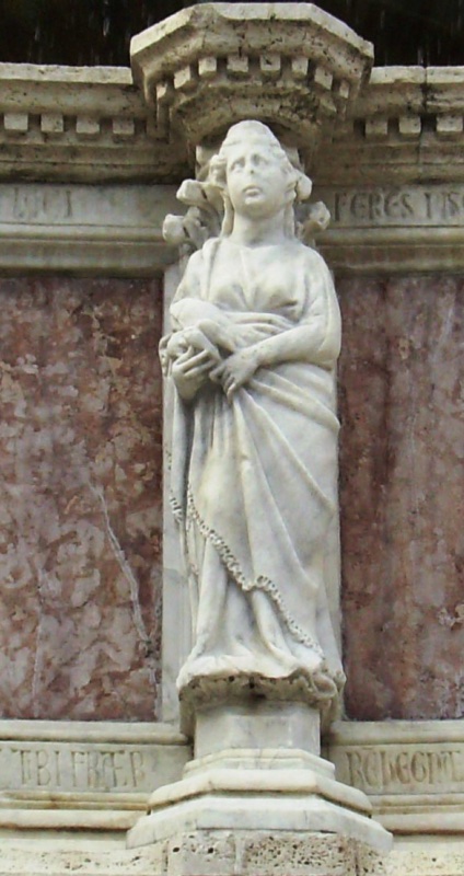 Fontana Maggiore, Perugia: statue of Domina Laci holding a fish of Lake Trasimeno in both hands, beneath the verse FERES PISCES, upper basin, 1278