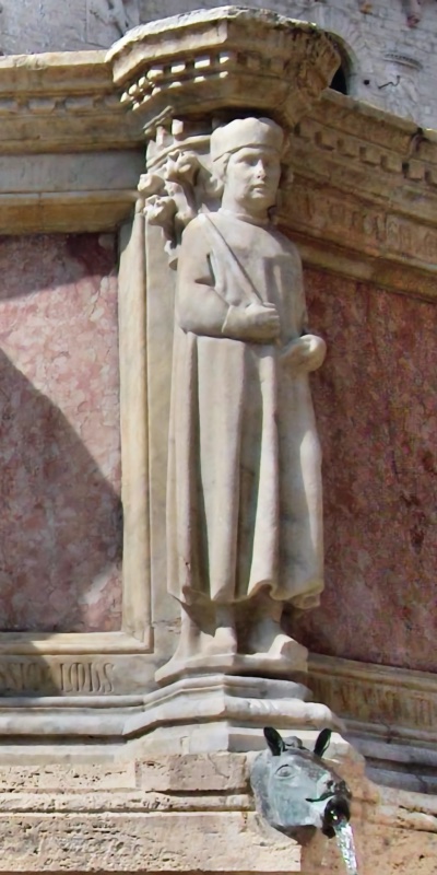 Fontana Maggiore, Perugia: statue of King Solomon, a youthful crowned figure holding a scroll diagonally across his chest, above a bronze animal-head water spout, 1278