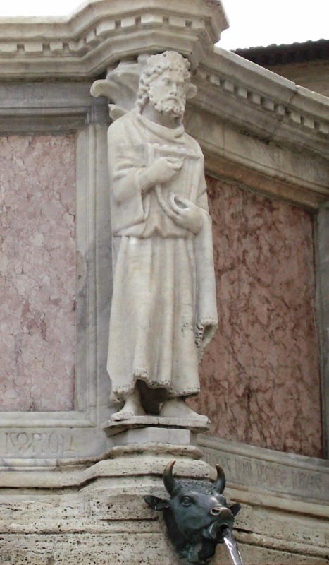 Fontana Maggiore, Perugia: statue of King David on the Fontana Maggiore in Perugia, a bearded figure plucking a small psaltery held against his chest, above a bronze bull-head water spout, 1278