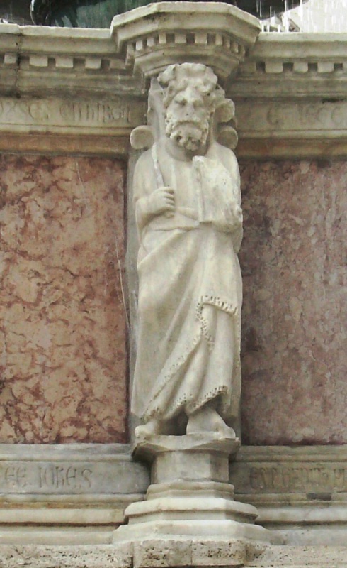 Fontana Maggiore, Perugia: statue of Moses, an aged bearded prophet holding a rod and the veiled Tablets of the Law, beneath the water falling from the bronze basin, 1278