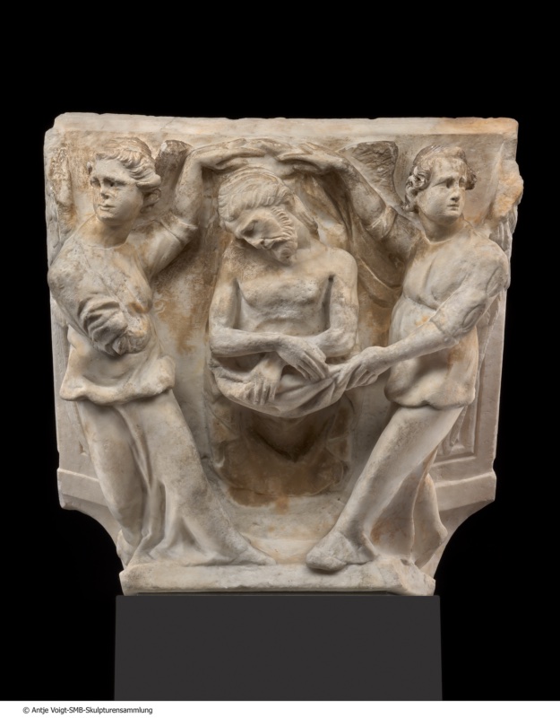 Squared marble block carved on its face with a shallow recess: at the centre the dead Christ rises half-length from the tomb, head fallen forward on the chest, arms crossed at the wrists; two winged angels in short tunics stand at either side, each raising one arm to hold a cloth arched above his head, the right-hand angel steadying his forearm. The upper surface of the block is flat and framed by a narrow lip.