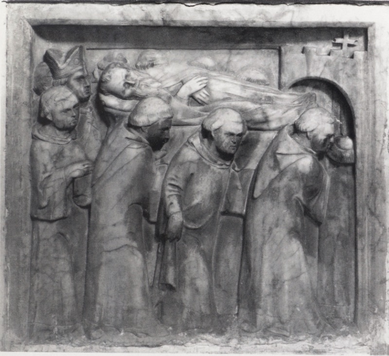 Marble relief attributed to Giovanni di Agostino, c. 1331, from a dismembered saint's shrine in Volterra: a procession of tonsured religious carries the bearded corpse of the saint shoulder-high toward the arched portal of a crenellated church at right, accompanied by a mitred bishop and a young acolyte at left; Museo Diocesano d'Arte Sacra, Volterra.