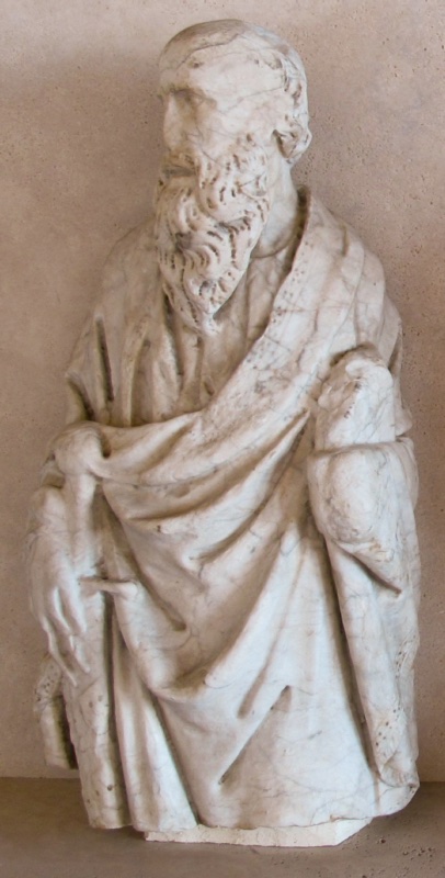 Marble half-length figure of a bearded apostle, identified as Saint Paul and attributed to Giovanni di Agostino: head turned to the viewer's left, a deeply folded mantle, the lowered hand at the left beside a beaded rectangular object, the lower edge broken off