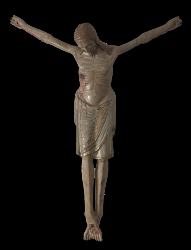 Polychrome wooden statue of the crucified Christ without its cross, arms raised diagonally. The emaciated body shows carved ribs, a bleeding side wound with painted blood running down the right leg, and red scourge marks on the limbs. The bowed head with closed eyes and brown hair is serene; a long grey-green loincloth with gilded borders reaches the knees
