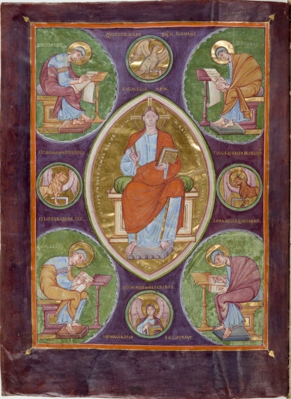 Ottonian manuscript page on a painted purple ground. At the centre, inside a pointed gold mandorla, Christ sits on a cushioned throne, wearing a light blue tunic and a red mantle, with a cross-inscribed halo; he blesses with his right hand and holds a jewelled book in his left. In four green circles at the corners, haloed evangelists sit at lecterns writing on scrolls or in books. Four smaller roundels between them contain the evangelist symbols: an eagle above, a winged lion at left, a winged ox at right and an angel below. Gold Latin verses run across the purple ground, and an orange and gold border frames the page
