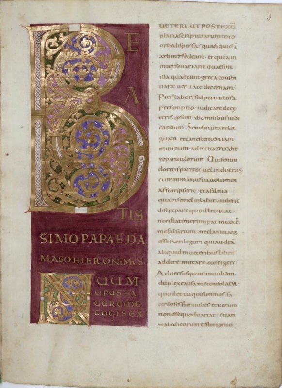 Ottonian manuscript page. At left, a tall panel painted in deep purple holds a monumental gold initial B, its shafts edged with white interlace and its bowls filled with gold scrolling vines on grounds of blue, green and pink dotted with white. Gold capitals beside and below the letter complete the words BEATISSIMO PAPAE DAMASO HIERONIMUS, followed by a smaller gold initial N beginning NOVUM OPUS FACERE ME COGIS EX. At right, a single column of text in gold minuscule on bare parchment continues Jerome's letter. The folio number 3 appears at the top right.