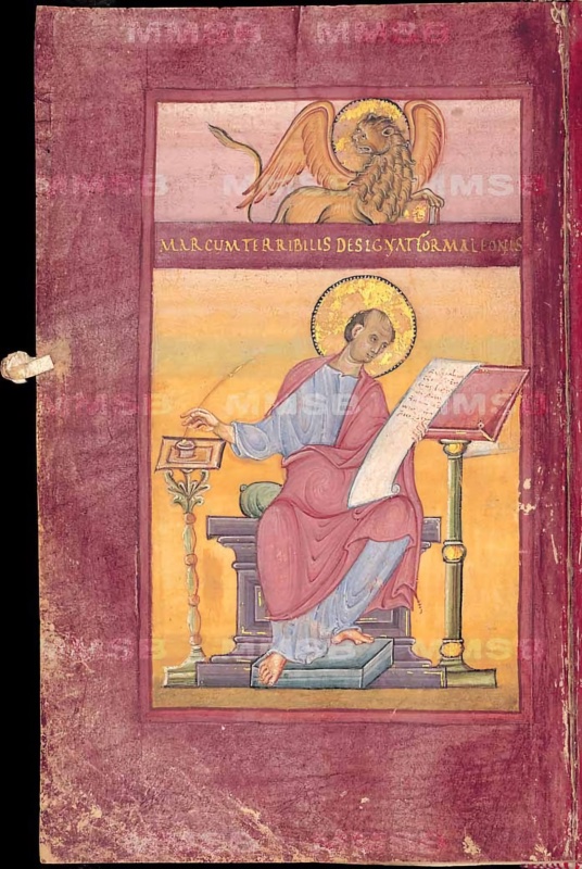 Ottonian manuscript page on purple-stained parchment. In an upper register on a pale pink ground, a haloed, winged golden lion with raised tail rests a forepaw on a closed book. Below it, a purple band carries one line of gold capitals: MARCUM TERRIBILIS DESIGNAT FORMA LEONIS. In the main field, on a warm golden-orange ground, the haloed, tonsured evangelist Mark sits on a violet block throne with a green cushion. He wears a light blue tunic and a rose mantle with a circular fold over his thigh, and dips a quill into an inkwell on a tall foliate stand at left, while a long inscribed scroll in his other hand unrolls toward a lectern on a green column at right. His bare feet rest on a grey footstool. A small parchment tab projects from the left edge
