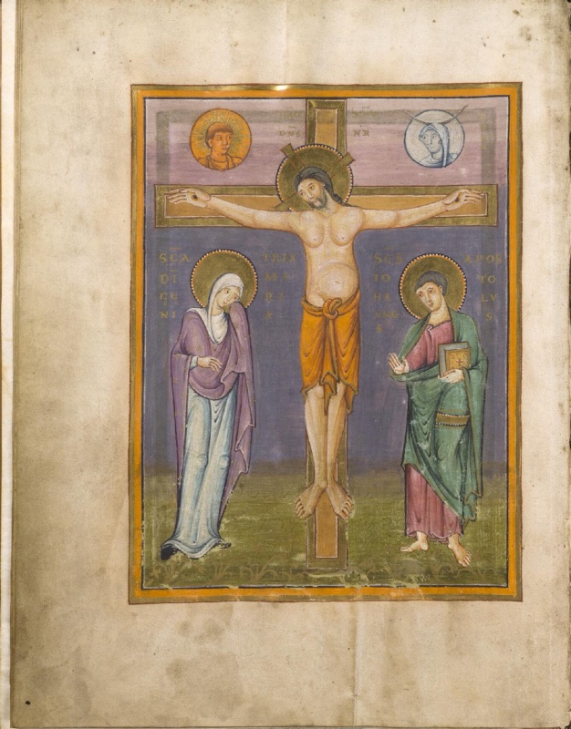 Ottonian manuscript miniature within an orange and gold frame. Christ hangs on a gold cross against a lilac sky above and a deep blue ground below, his arms straight, his bearded head with a cross-inscribed halo inclined to one side, his pale body modelled with a rounded abdomen and an orange loincloth knotted at the waist. Above the crossbar, two roundels show the Sun as a young man with a radiant halo and the Moon as a veiled woman beneath a crescent. Gold letters near the top of the cross name Jesus Christ our Lord. At left the Virgin Mary, veiled in white and purple over a blue gown, bows her head in grief; at right the young Saint John, in a pink tunic and green mantle, holds a jewelled book and raises his hand. Gold inscriptions name both. They stand on a green ground with small plants.