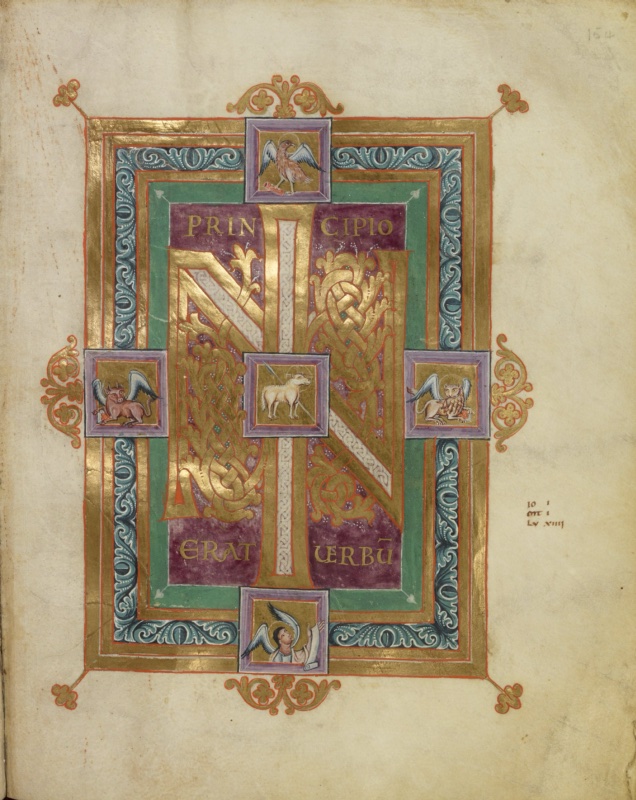 Ottonian manuscript incipit page. On a deep purple panel, a gold monogram combines the letters I and N: the I rises through the centre, filled with white interlace, while the N is formed by two uprights of dense gold interlace and foliage joined by a diagonal band of white interlace. Gold capitals read PRINCIPIO above and ERAT VERBU(M) below. A small square at the centre of the monogram shows a white Lamb of God with a slender staff. Four further squares on the axes of the frame hold the evangelist symbols on gold grounds: the eagle above, the winged ox at left, the winged lion at right and the angel below. The frame has gold, green and blue bands with white foliate ornament, gold foliate crests at the midpoints and gold fleur-de-lis finials at the corners. A short note in small minuscule appears in the right margin